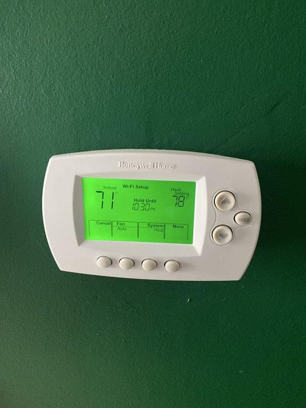Completed comprehensive BFMA tune-up service on a 16+ year old gas furnace system. Performed thorough inspection of burner assembly, ignition system, and gas valve components, verifying proper operation of all heating elements and flame sensors. Inspected and tested Honeywell Home Wi-Fi thermostat, confirming accurate temperature readings and proper communication with heating system, with unit currently set to maintain 79 degrees in heating mode.