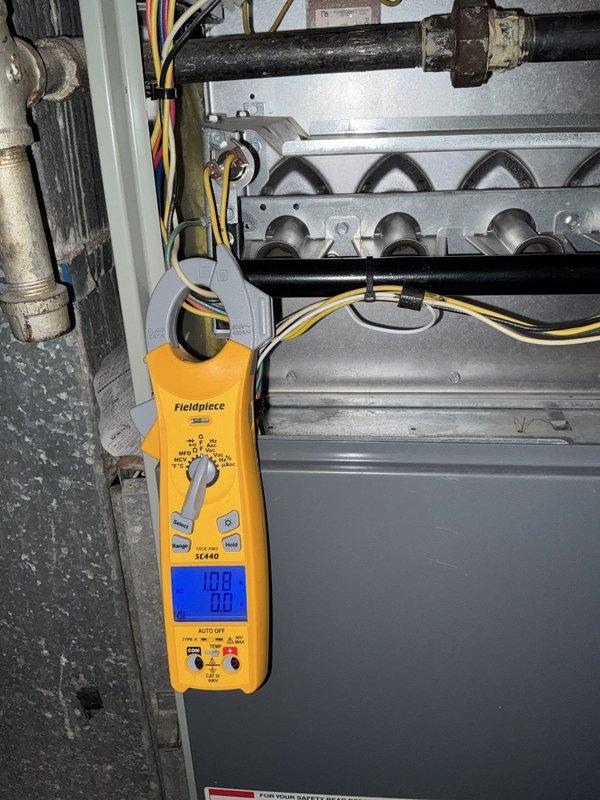 Completed comprehensive BFMA tune-up on 15-year-old furnace system located in basement. Performed standard maintenance protocol including full system inspection, burner assembly cleaning, heat exchanger examination, and electrical component testing using digital clamp meter to verify proper amperage draw. Evaporator coil displayed significant frost and ice accumulation indicating potential airflow restriction or refrigerant issue requiring monitoring. All gas connections, piping, and electrical wiring inspected and confirmed secure with no immediate safety concerns identified.
