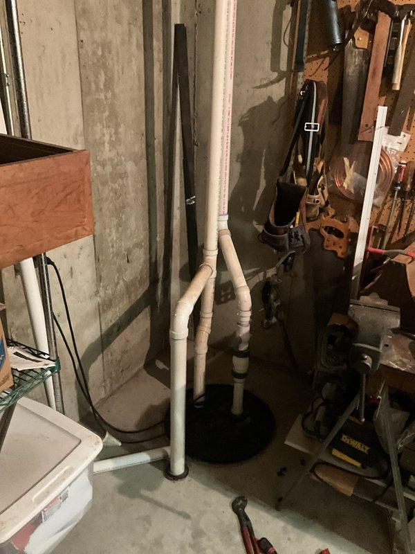 Completed comprehensive BFPMA Tune Up including full plumbing system evaluation, water heater tank flush to address brown water discoloration issue, and sump pump inspection revealing significant sediment accumulation and debris buildup in pump basin requiring cleaning for optimal operation.