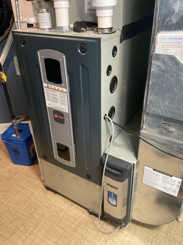 Completed comprehensive BFMA tune-up service on residential furnace and tankless water heater system. Performed complete furnace maintenance inspection including burner assembly cleaning, flame sensor service (component removed and cleaned as shown in documentation), heat exchanger inspection, blower motor evaluation, and venting system verification. Inspected all PVC condensate drain lines and confirmed proper operation of condensate pump. Conducted tankless water heater maintenance including descaling procedure, burner inspection, and combustion analysis to ensure optimal efficiency and safe operation.