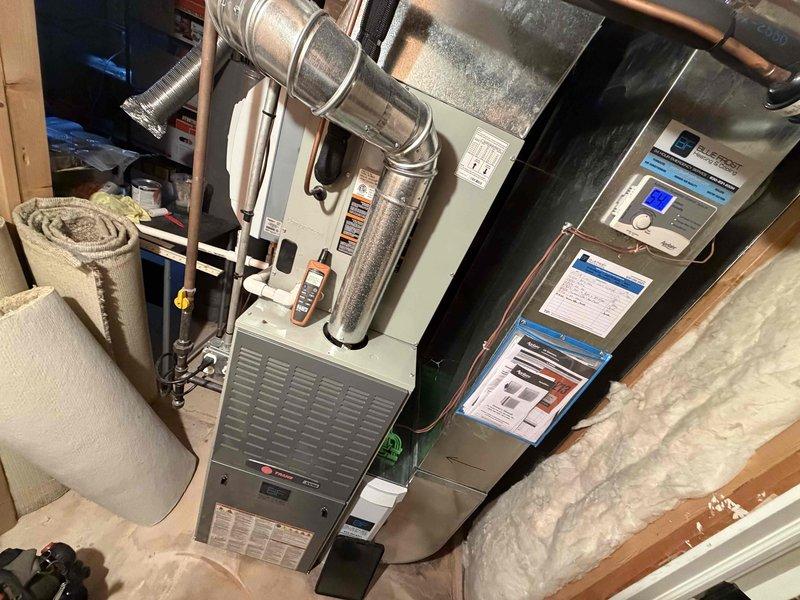 Completed comprehensive BFMA tune-up on 5-year-old gas furnace system including full furnace inspection, humidifier service, and filter replacement. Inspected gas valve assembly, burner tray with four burners, ignition components, and all electrical connections throughout the heating system. Verified proper operation of all combustion components, checked gas piping connections, and confirmed secure wiring with proper terminations. Serviced humidifier unit, replaced air filter, and tested system controls and thermostat functionality. All ductwork connections inspected and found secure. System operating within manufacturer specifications with no deficiencies noted.
