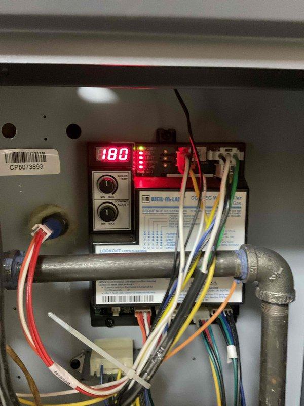 Completed comprehensive BFMA tune-up service on 2-year-old boiler system per LL1 compliance requirements. Performed full system inspection, monitored operating pressures and temperatures which registered at 188°F on digital control display, verified all gauges reading within normal parameters, and inspected copper piping connections for integrity. Documented system conditions with photos showing pressure/temperature gauges, control panel with digital readout, and overall equipment operation for service records.