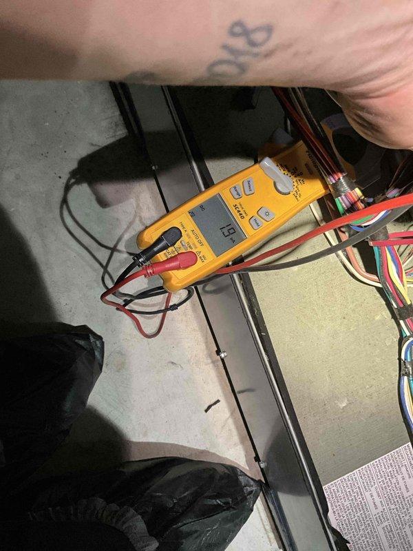 # Furnace Winter Tune-Up Completed

Performed comprehensive winter tune-up on 4-year-old Trane furnace system located in basement. Conducted full system diagnostics including electrical testing with digital multimeter to verify proper voltage and amperage across all circuits. Inspected control board wiring, relay functions, and electrical connections throughout the system.

During inspection, identified moderate to heavy rust and corrosion on burner assembly components, specifically on the burner ports and flame sensor area. Corrosion appears consistent with normal condensation exposure over the unit's operational period but will require monitoring for potential performance impact. All burner orifices show surface oxidation with visible rust discoloration on perforated surfaces.

Tested all safety controls, limit switches, and flame sensors for proper operation. Verified ignition sequence, flame characteristics, and burner operation across all zones. Confirmed proper airflow through he
