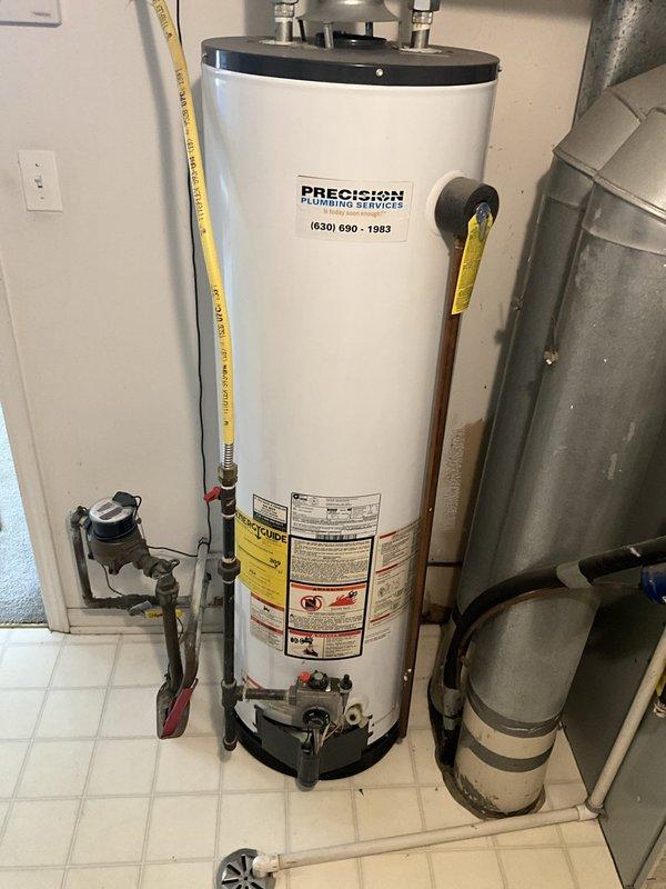Responded to no hot water complaint at residential property. Upon arrival, evaluated existing 40-gallon tanked water heater that had failed and was no longer producing hot water. Assessed utility room conditions and existing plumbing connections including water supply lines, gas line, pressure relief valve, and venting system. Provided estimate for complete water heater replacement. Documented existing installation with photos showing water heater unit, associated plumbing connections, gas line routing, electrical components, and surrounding mechanical systems for replacement planning purposes.