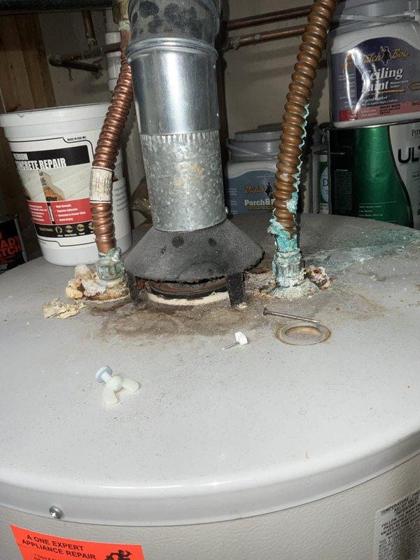 Completed comprehensive BFMA tune-up service on 14+ year old furnace system. Performed standard maintenance protocol including inspection of all mechanical components, burner assembly cleaning, filter evaluation, and safety control testing. Documented existing conditions of water heater showing significant corrosion and mineral buildup at top connections, along with copper pipe oxidation in utility area requiring future attention.
