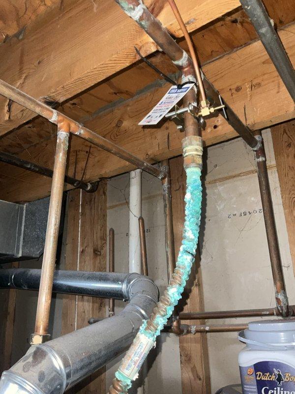 Completed comprehensive BFMA tune-up service on 14+ year old furnace system. Performed standard maintenance protocol including inspection of all mechanical components, burner assembly cleaning, filter evaluation, and safety control testing. Documented existing conditions of water heater showing significant corrosion and mineral buildup at top connections, along with copper pipe oxidation in utility area requiring future attention.