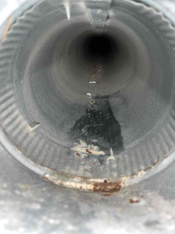 Completed comprehensive duct cleaning service for residential HVAC system. Inspection revealed significant debris accumulation, dust buildup, and rust-colored staining within the ductwork, particularly in the lower sections of the cylindrical flexible ducts and rectangular metal supply channels. Performed thorough cleaning of all accessible ductwork components, removing accumulated particulates and contamination from interior surfaces. System components showed normal operational wear consistent with extended service life. All ductwork connections and metallic collars were inspected and verified structurally sound following cleaning procedures.