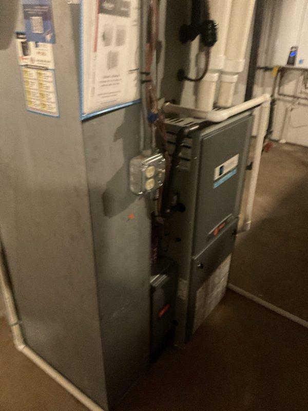 Completed comprehensive BFMA tune-up on 10-year-old residential furnace system located in basement mechanical room. Performed full inspection of forced-air unit including burner assembly, heat exchanger, blower motor, and all electrical connections. Verified proper operation of safety controls, tested ignition system, and confirmed adequate combustion air supply. Cleaned burners, inspected and replaced air filter, checked gas pressure and manifold settings, and verified proper venting through PVC exhaust system. Tested thermostat communication and system cycling, confirmed proper airflow through ductwork, and inspected condensate drainage lines for blockages. All components found operating within manufacturer specifications with no immediate safety concerns identified. System is functioning efficiently and ready for heating season.
