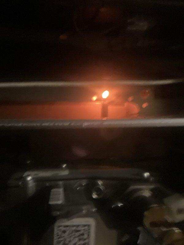 Performed a seasonal furnace tune-up on a one-year-old gas furnace, inspecting the burner compartment and verifying proper ignition and a stable flame, along with a check of the gas valve assembly and connections. Also inspected the adjacent venting, gas piping, and shutoff valves for secure fittings and proper operation. System operated normally at completion with no deficiencies noted.