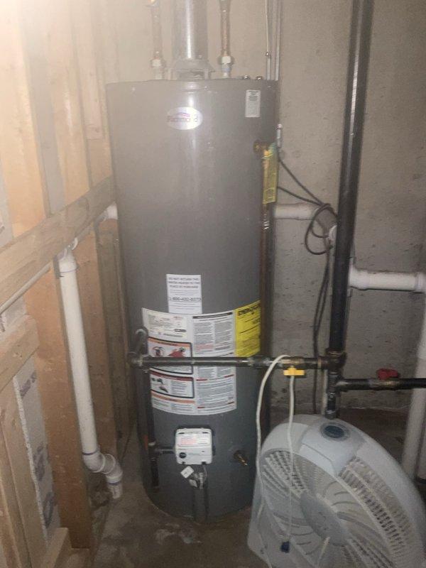 Performed a seasonal furnace tune-up on a one-year-old gas furnace, inspecting the burner compartment and verifying proper ignition and a stable flame, along with a check of the gas valve assembly and connections. Also inspected the adjacent venting, gas piping, and shutoff valves for secure fittings and proper operation. System operated normally at completion with no deficiencies noted.