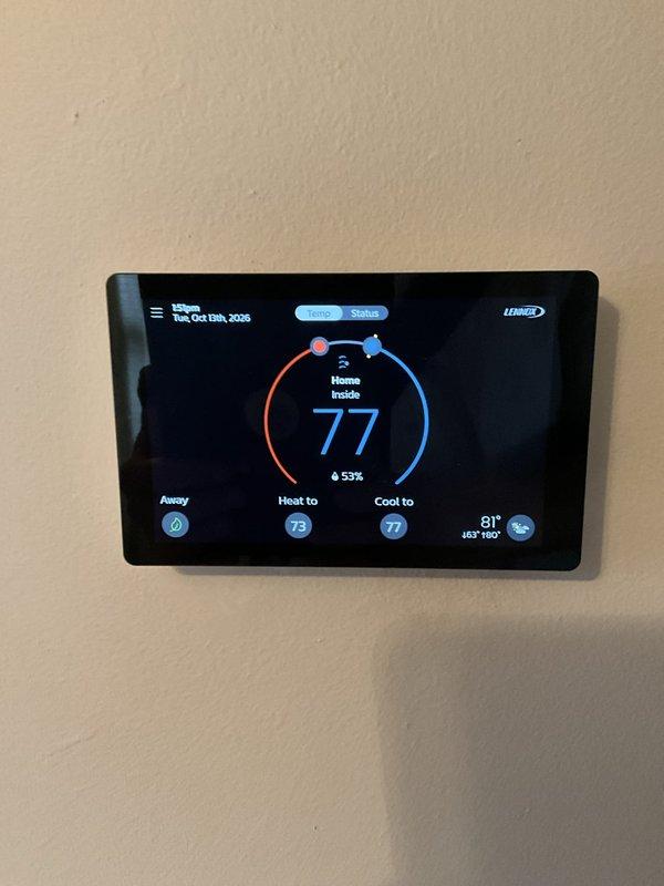 Performed a routine tune-up on a two-year-old gas furnace, including filter replacement and humidifier maintenance, with no issues or abnormal symptoms found. Inspected the whole-home Aprilaire humidifier and its duct and water line connections, finding no leaks, rust, or damage. Verified normal thermostat operation, with indoor conditions at 77°F and 53% humidity.