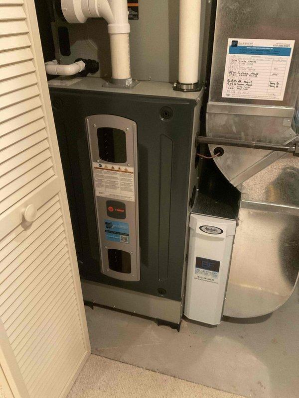 Performed a seasonal tune-up on a 3-year-old Trane gas furnace, inspecting the burner assembly, heat exchanger, flue and condensate drain lines, blower components, and safety controls, and verifying proper ignition and operation. Inspected the connected Aprilaire unit and ductwork, confirmed the equipment is clean and in good condition with no signs of rust, leaks, or damage, and updated the service log for the recurring maintenance plan.