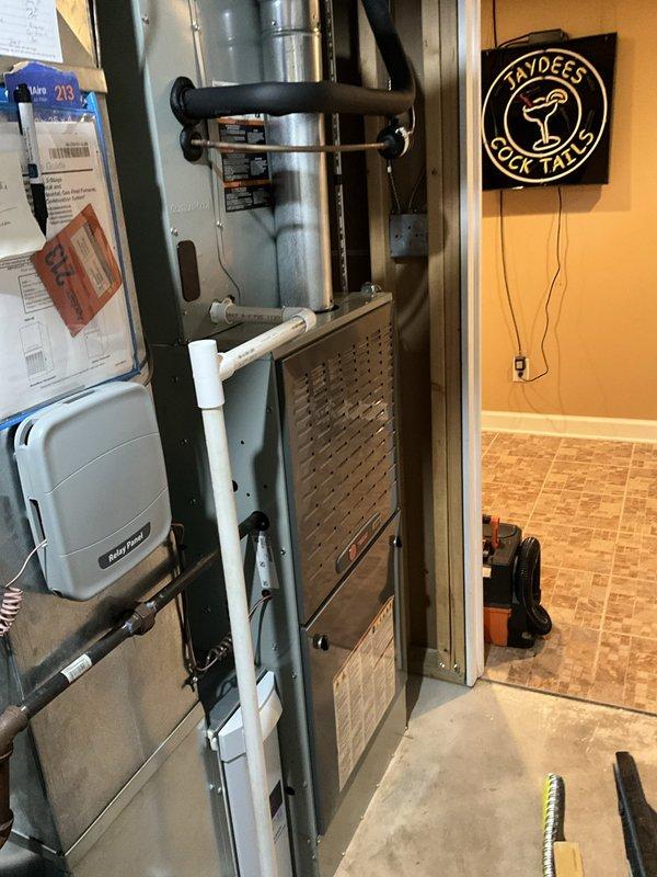 Performed a seasonal heating tune-up on a 6-year-old Trane gas furnace, inspecting the cabinet, flue piping, PVC condensate/vent lines, gas piping, and relay panel connections. Verified the equipment was clean and free of visible rust, frost, or damage, and confirmed proper operation, with no deficiencies noted. Also inspected the outdoor condenser unit and pad, finding the unit clean with refrigerant lines and conduit intact.