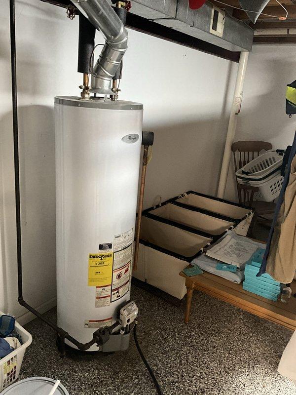 Arrived during the confirmed morning window to evaluate the reported leak between PVC piping sections, the existing sump pump and radon system, and the water heating setup. Inspected the sump pump and radon mitigation components, assessed the PVC connections for possible replacement, and prepared a quote for sump pump replacement. Evaluated the existing gas-fired tank water heater, including venting, gas line, and clearances, to provide an estimate for tankless water heater installation, noting no visible leaks, rust, or damage at the equipment.