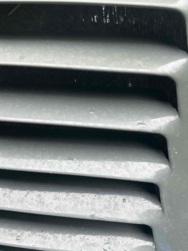 Performed a seasonal cooling maintenance tune-up on a 4-year-old Trane system, including inspection of the air handler/furnace cabinet and evaporator airflow components. Replaced the 20x25x4 return air filter with a new Honeywell MERV 8 pleated filter to restore proper airflow and system efficiency, and cleaned the louvered grille and vent surfaces to remove dust buildup. System was left operating normally upon completion.