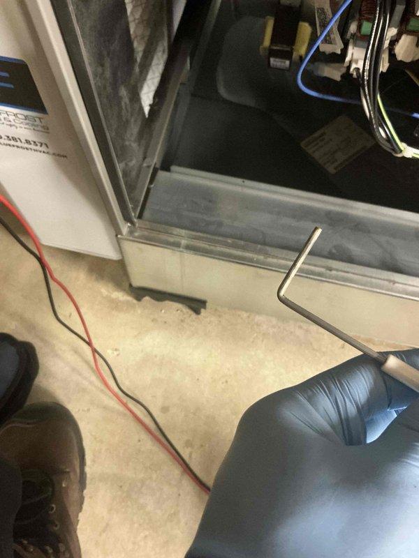 Performed a routine tune-up on a 1-year-old split system, inspecting the air handler cabinet, electrical connections, and air filter, and servicing the unit to confirm normal operation with no deficiencies found. Walked the home to identify and remove leftover protective blue plastic and tape covering supply registers from a recent duct cleaning, restoring full airflow at the affected vents. Advised that the covering is a standard part of the duct cleaning process and that the ducts were cleaned.