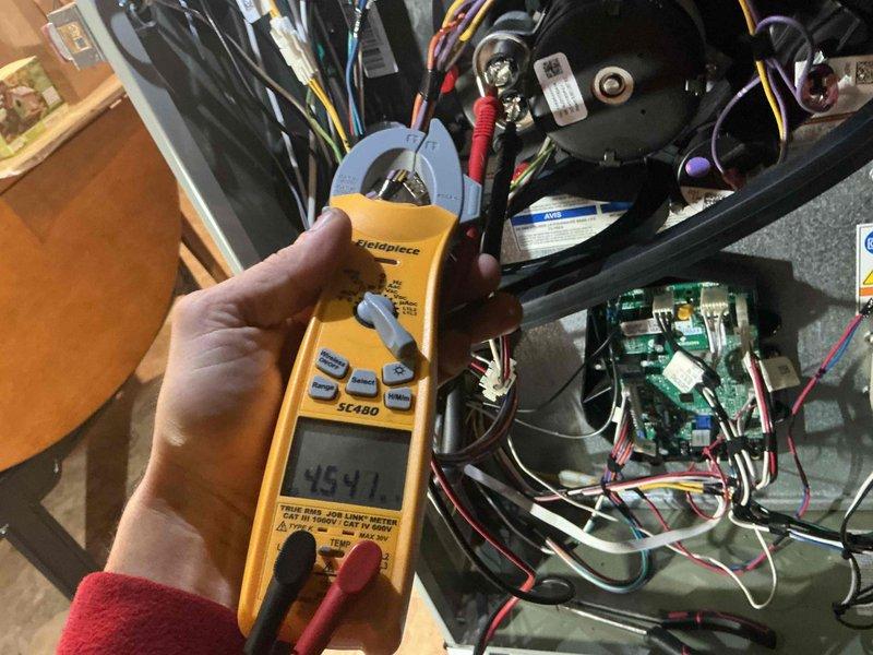 Performed a full furnace tune-up on 8+ year old equipment, including inspection of the electrical compartment and electrical testing of components with a clamp meter to verify proper operation of the blower motor circuit and control wiring. Removed and inspected the flame sensor/igniter assembly for wear and contamination, and checked the wiring harnesses, connections, and control board for secure fit and condition. Reassembled the unit and confirmed it was operating properly.