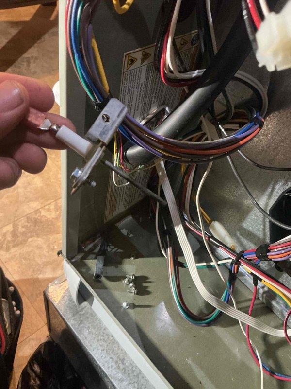 Performed a full furnace tune-up on 8+ year old equipment, including inspection of the electrical compartment and electrical testing of components with a clamp meter to verify proper operation of the blower motor circuit and control wiring. Removed and inspected the flame sensor/igniter assembly for wear and contamination, and checked the wiring harnesses, connections, and control board for secure fit and condition. Reassembled the unit and confirmed it was operating properly.