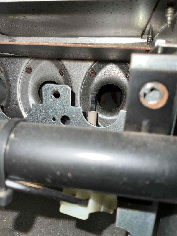Performed a complete tune-up on a 13+ year-old gas furnace, inspecting the burner compartment, igniter/flame sensor, and manifold, and noting minor surface rust on burner access panel fasteners. Verified the air filter was clean and properly seated, with no restriction to airflow. Furnace is operating normally.
