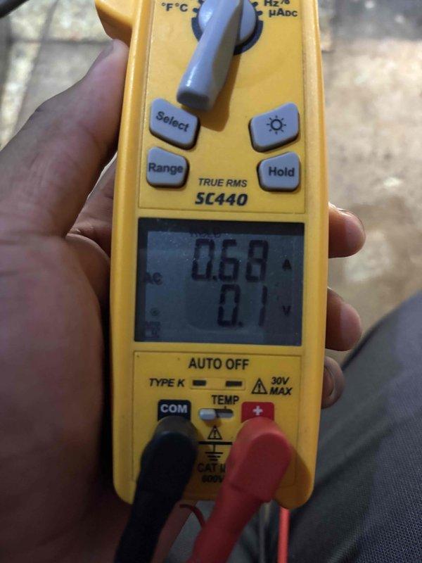 Performed a seasonal heating tune-up on an upright gas furnace, including inspection of the burner assembly and verification of normal ignition with a stable blue flame. Used a true RMS clamp meter to check electrical readings, and inspected the flue vent piping, condensate drain, and surrounding cabinet and connections for proper operation. The unit showed no signs of heavy rust or major damage and was left operating normally.