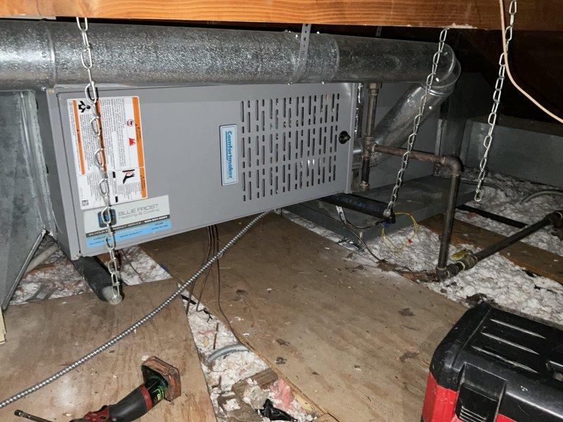 Performed a furnace tune-up on an 11+ year-old Comfortmaker horizontal furnace/air handler suspended in the attic, inspecting the cabinet, ductwork connections, and gas piping, and verifying safe operation. Carbon monoxide levels were tested with a calibrated meter and measured 0 ppm, with no abnormal readings detected.