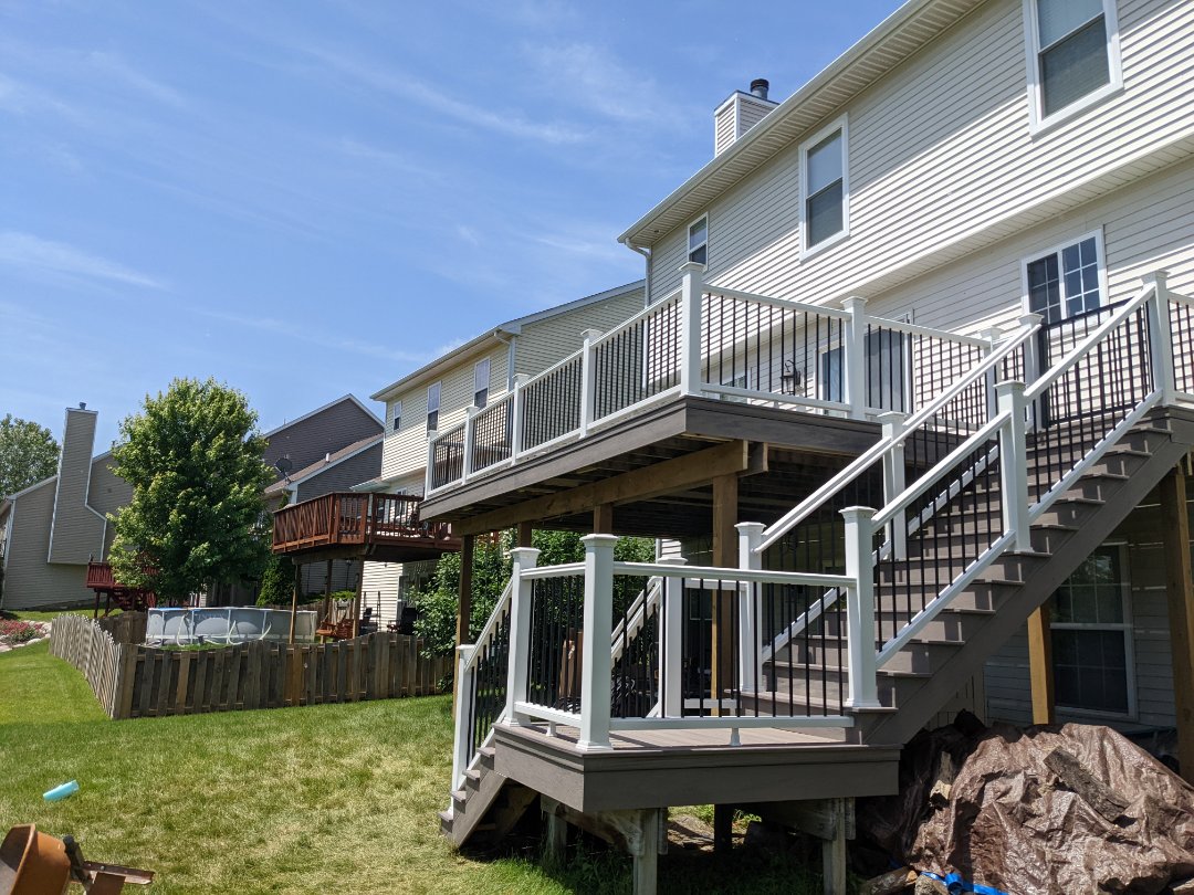 beautiful retop with rocky harbor decking and fascia and white rail in dexter