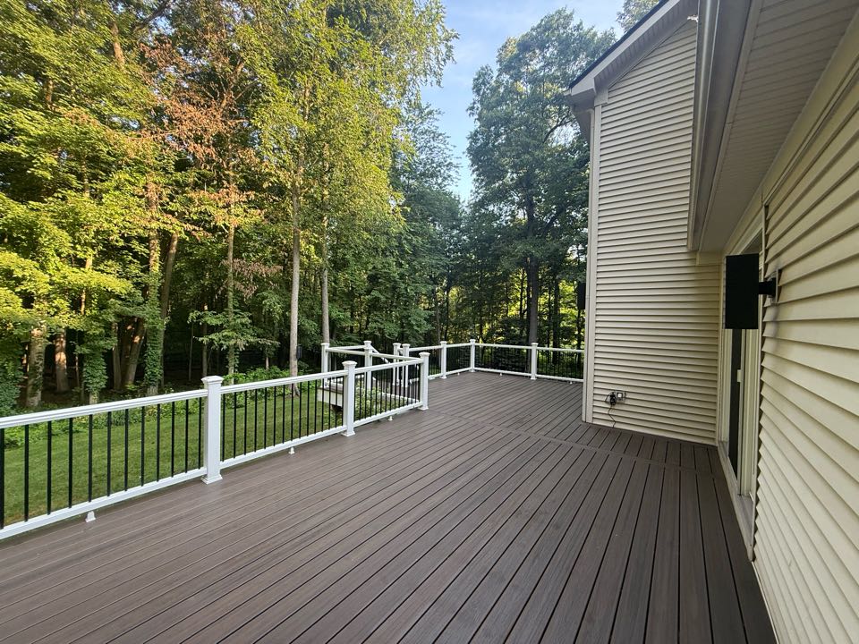 Just wrapped up this beautiful custom Trex deck in Brighton MI. This deck featured Trex Enhanced Naturals Costal Bluff decking, with white Trex Transcend rails and Trex Lighting in the post caps and risers. Another satisfied customer.