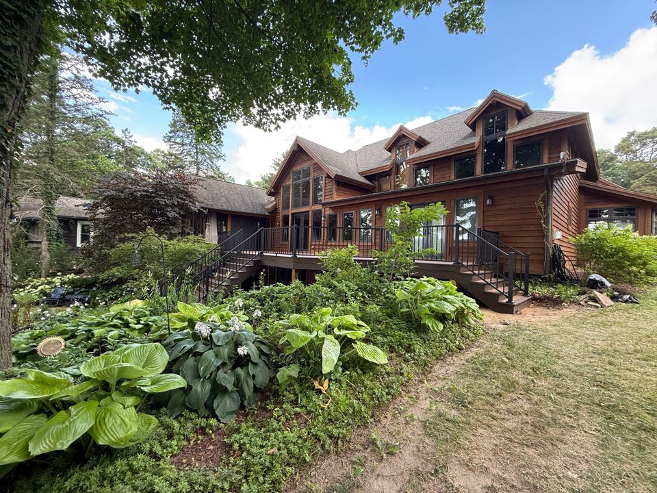 Just wrapped up the 600 Sq ft beauty of a deck! This deck features a warm color concept made up of Trex Transcend Lineage Hatteras decking with a Sliced rum border. Followed up with Trex Signature black railings.  A perfect deck to sit out on and watch the lake. 