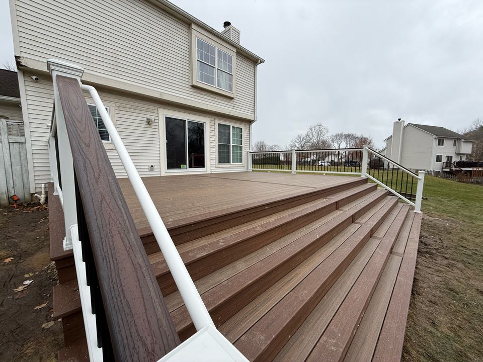 Just wrapped up this great looking Trex deck in South Lyon MI. Trex Toasted Sand and Cinnamon Cove come together nicely! The White Trex Transcend Railing with the Lava Rocky cocktail rail really makes eveything pop! Enjoyed working on this one!