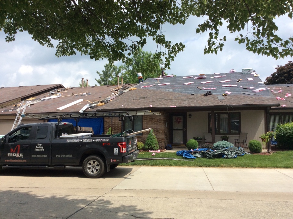 Indianapolis, IN - During the job it's 108 squares Owens Corning flagstone shingles Indianapolis, IN - During the job it's 108 squares Owens Corning flagstone shingles