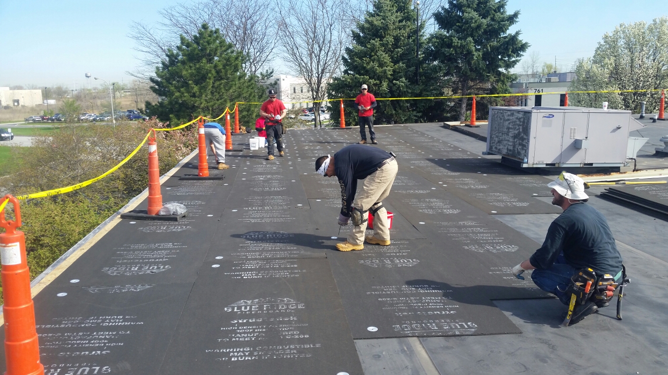 Munster, IN - Installing 1/2" fiberboard and preparing to accept fully adhered EPDM roofing system. Munster, IN - Installing 1/2" fiberboard and preparing to accept fully adhered EPDM roofing system.