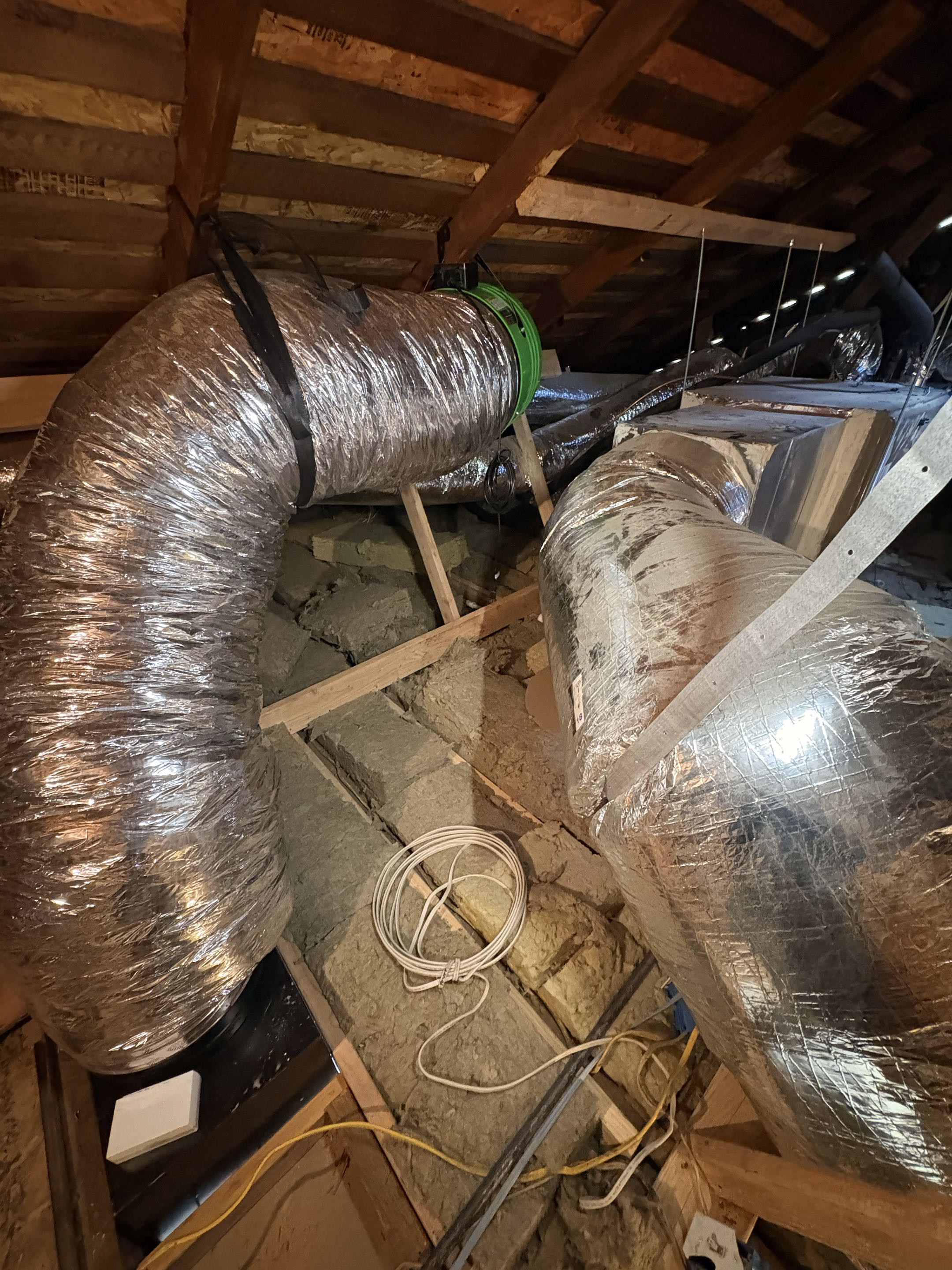 New attic fan installation. New Whole house fan installation. Home remodel in construction. 