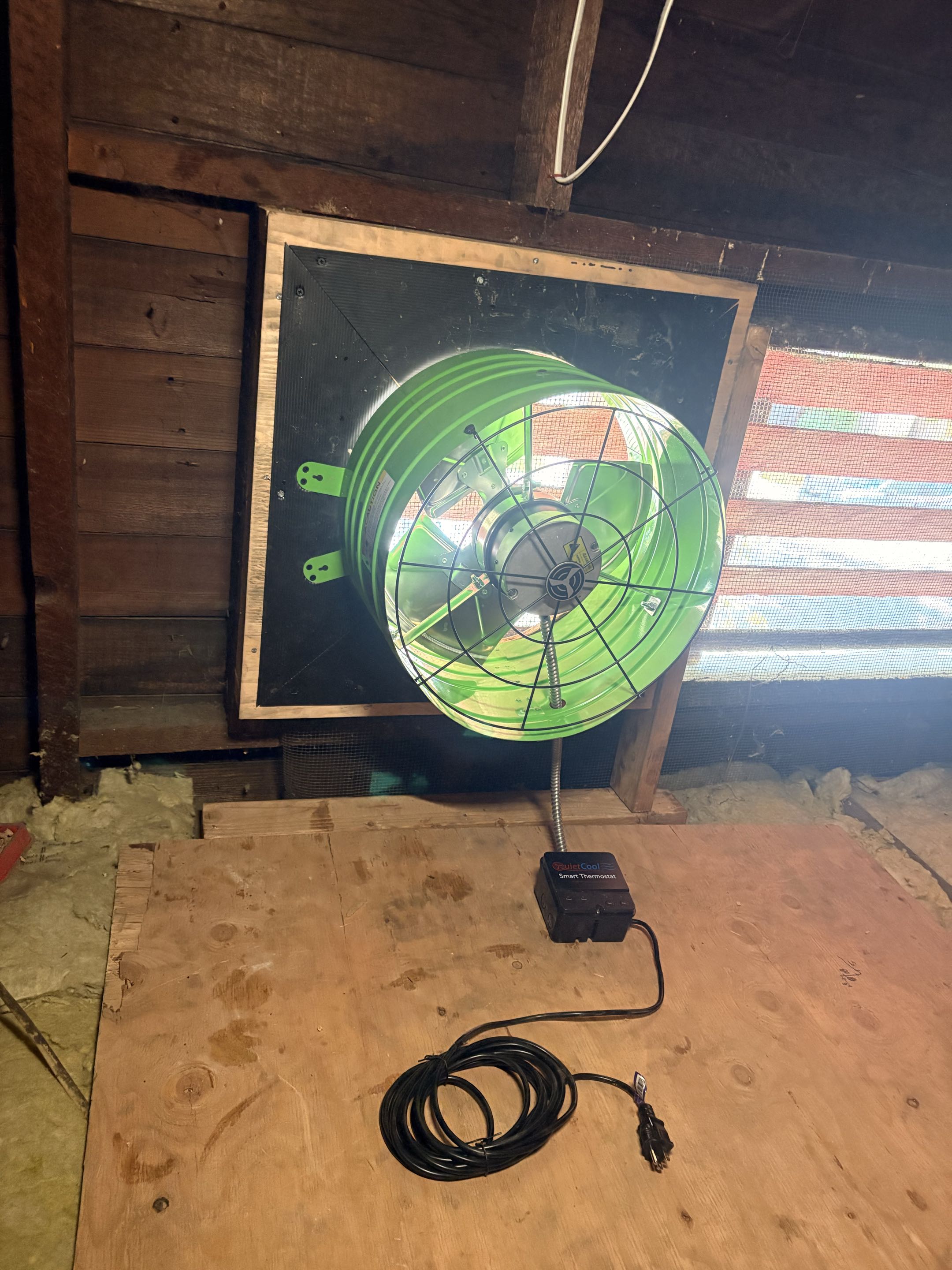 New attic fan installation. New Whole house fan installation. Home remodel in construction. 