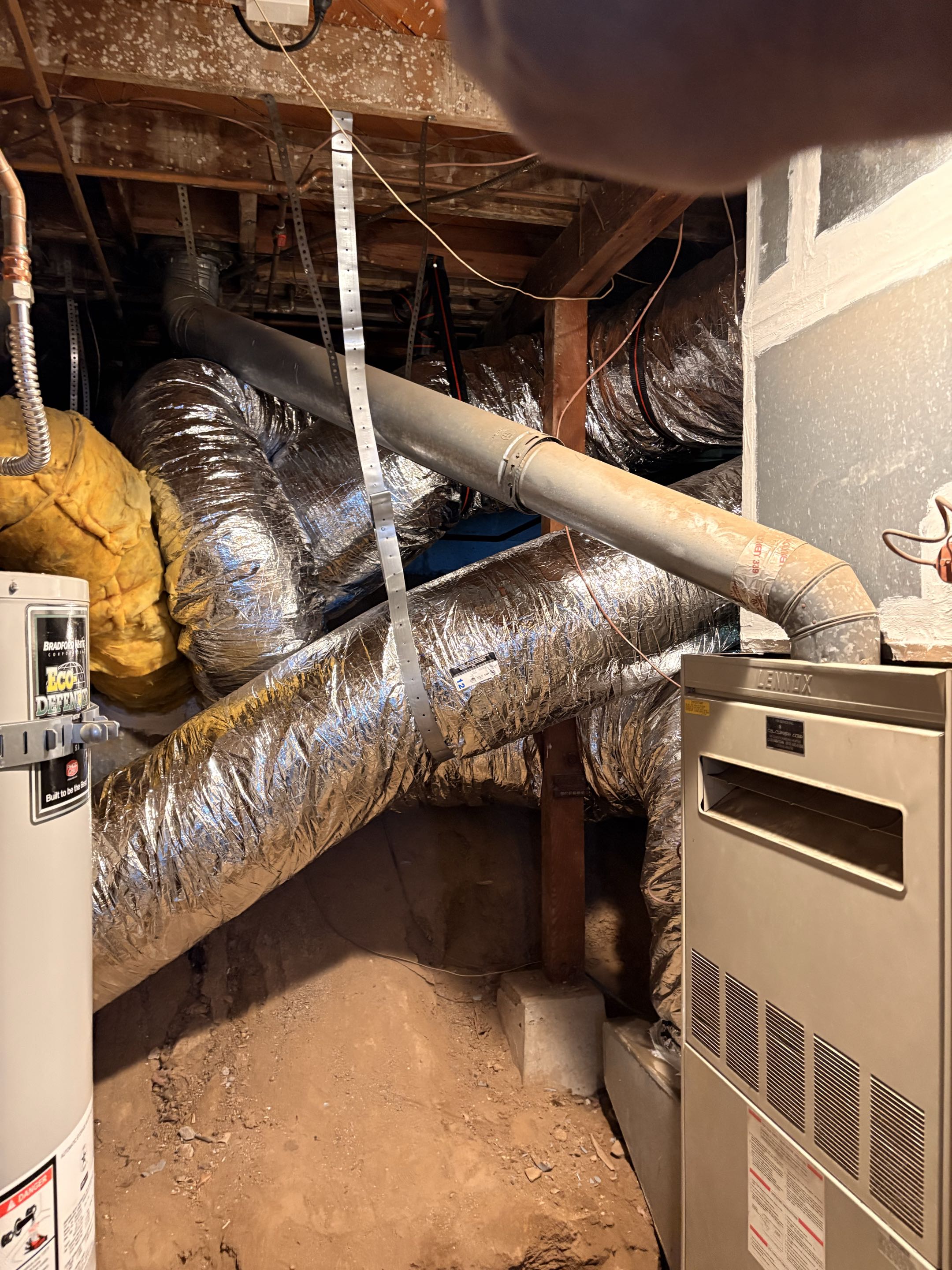 New duct installation. Basement, 1st level. Seal joints, weather proof, hang, strap above the ground. New washable filter system. 