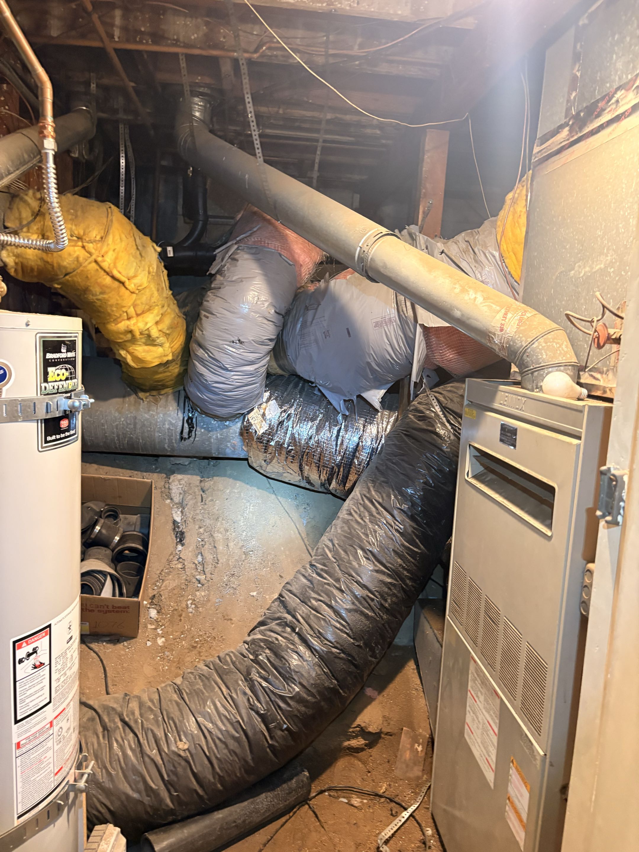 New duct installation. Basement, 1st level. Seal joints, weather proof, hang, strap above the ground. New washable filter system. 