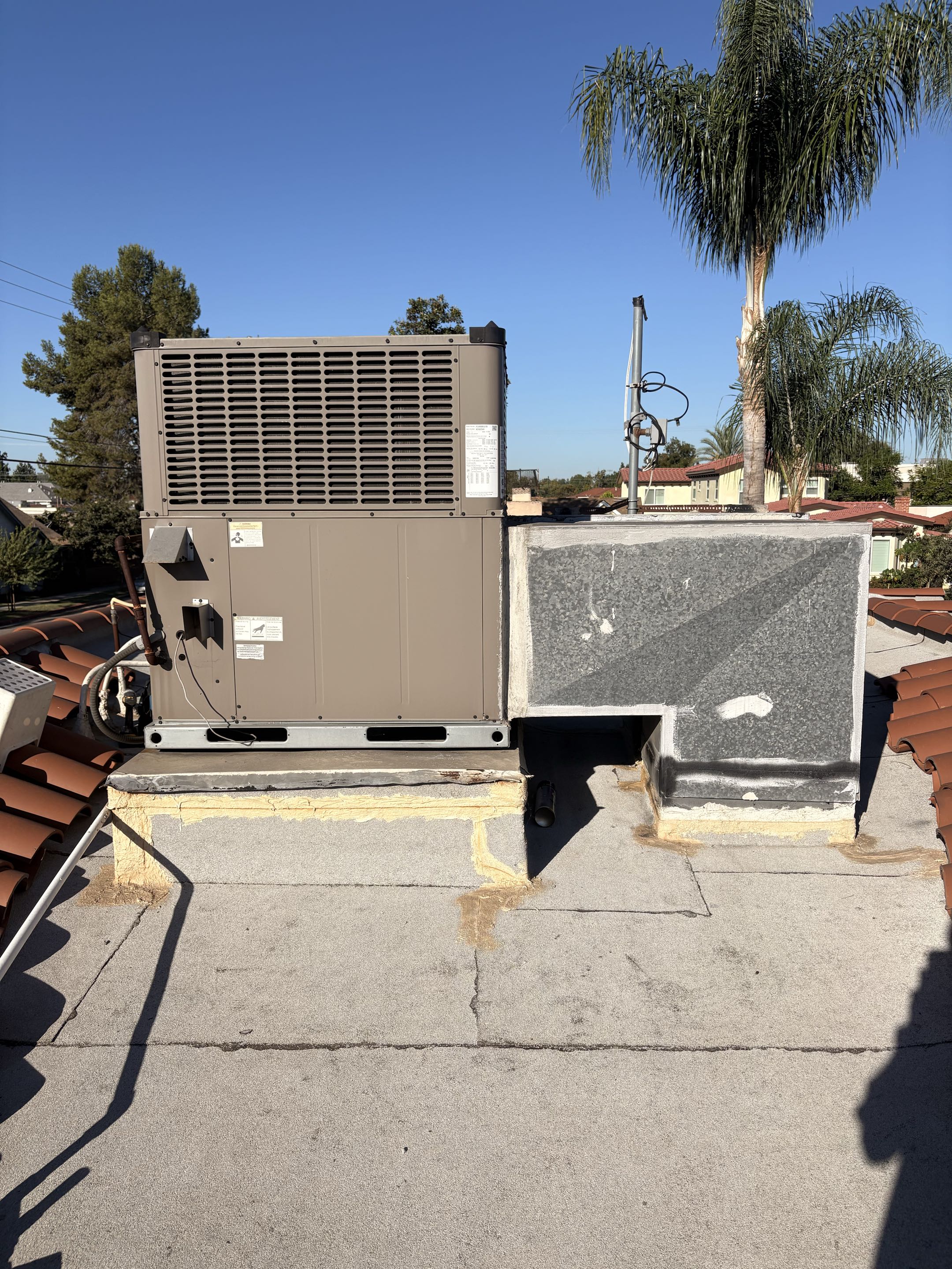 Residential service call. York package unit experiencing cooling issues. Perform check service maintenance, electrical components, condenser, evaporator coils debris, and dirty filter. Thermostat loose off base plate. 