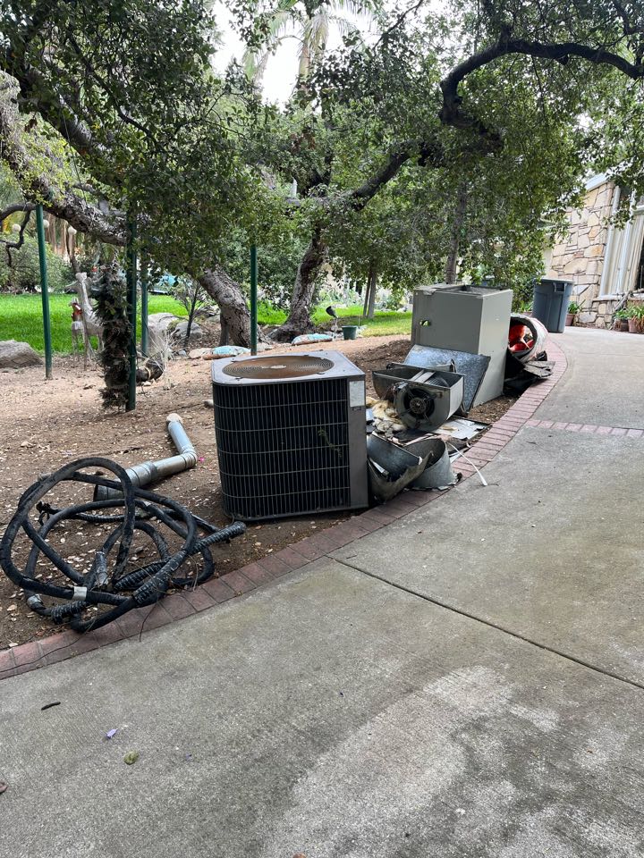 Removing this gas split system and installing a heat pump here in Pasadena 