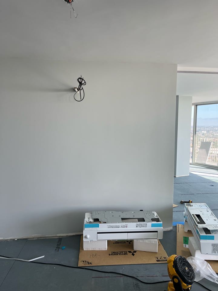 Installing Mitsubishi ductless units we did during rough construction now they are ready for finish here in Long Beach 