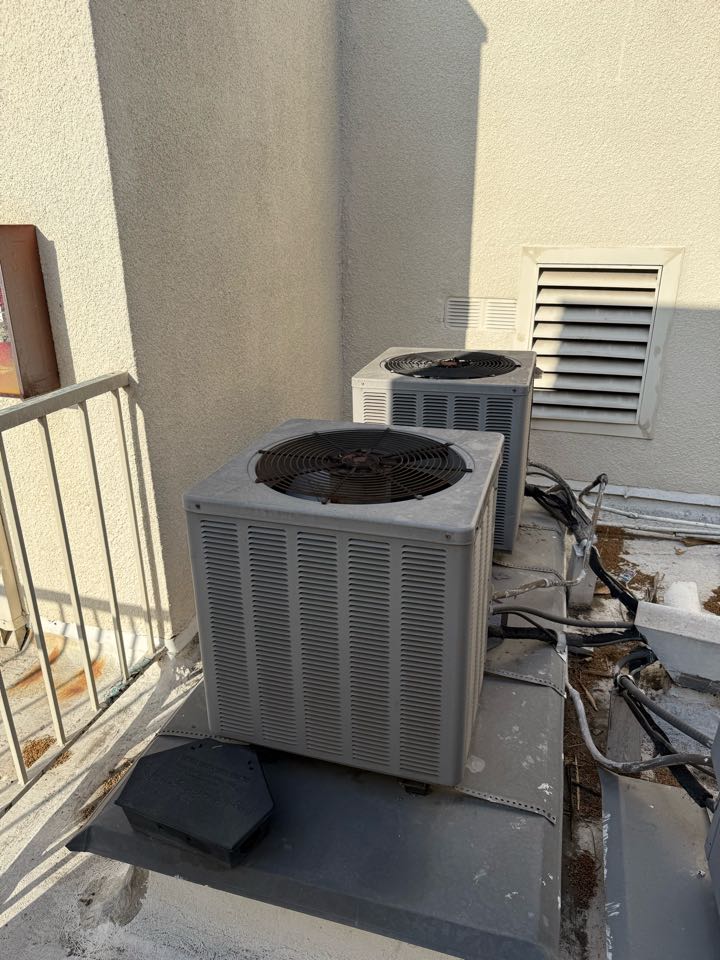 Los Angeles, CA - Working on a condenser near Wilshire Los Angeles, CA - Working on a condenser near Wilshire