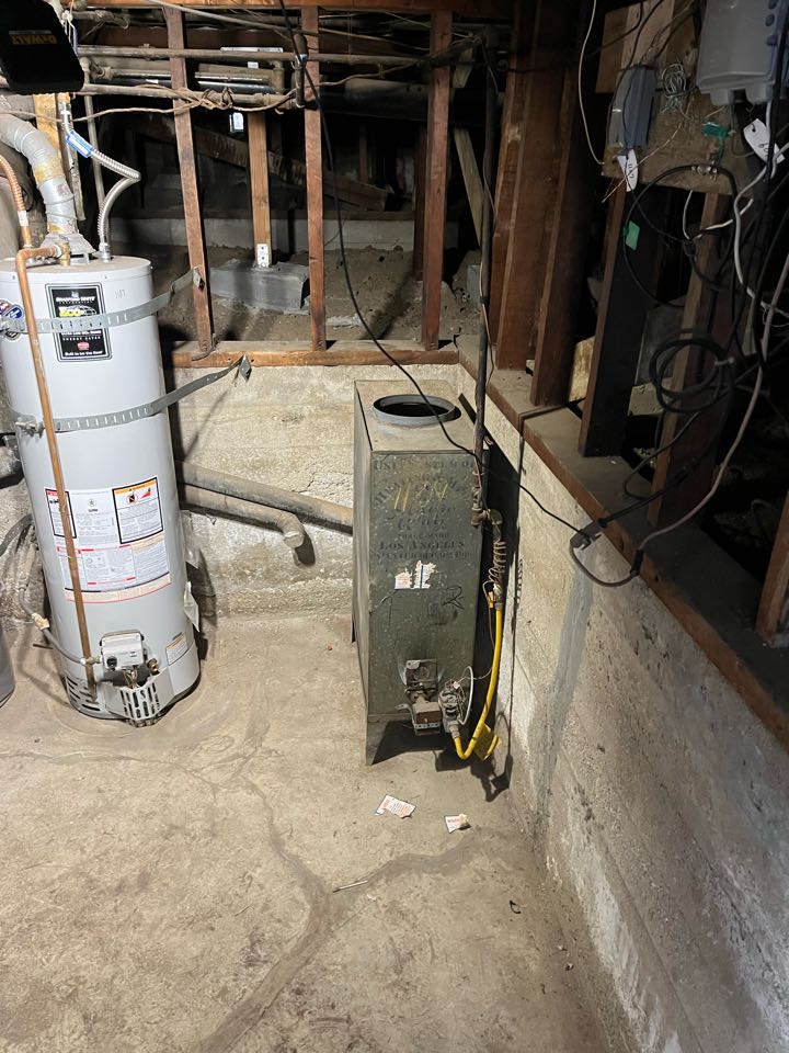 Los Angeles, CA - Changing out this old gravity furnace to a split system with all new ducting here in LA Los Angeles, CA - Changing out this old gravity furnace to a split system with all new ducting here in LA