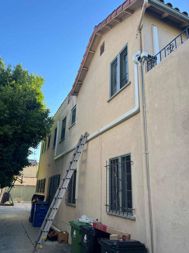 Installing a 3 zone ductless mini split with condenser going on a wall bracket above the driveway here in Hancock Park