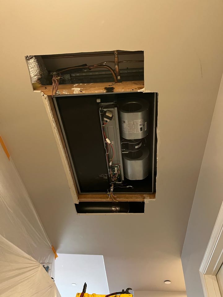 Installing a heat pump air handler split system inside a case. We had to re frame the ceiling for the bigger cased unit in a condo here in Glendale 