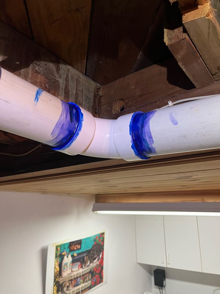 Sealing some flu pipe connections for a 95% furnace here in Altadena 