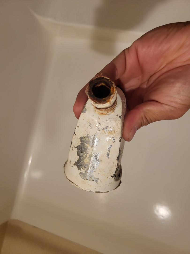 Cha grout of retro shower head. Symmons shower head. 