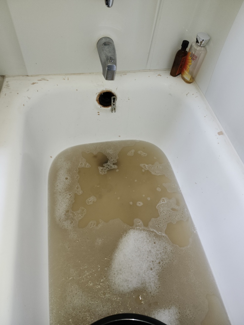 Clogged Back 2 back shower tubs 
