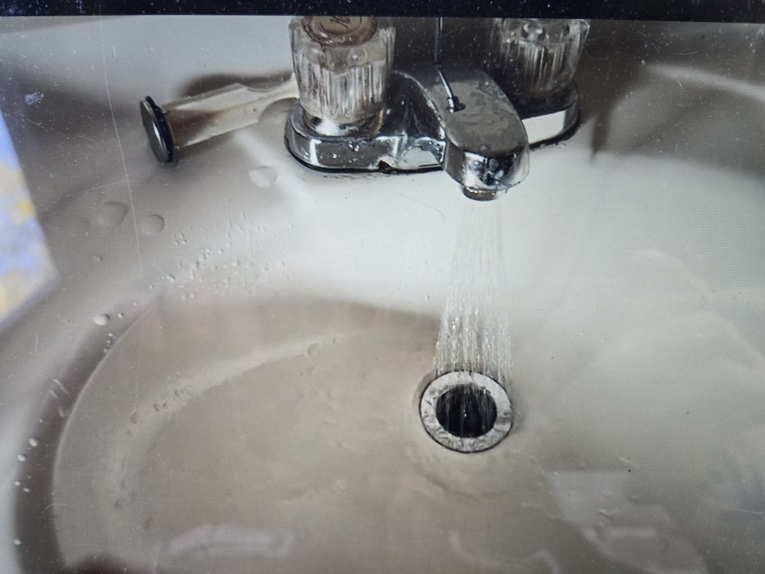 cabled through lav sink drain in upstairs bathroom. Highland park 