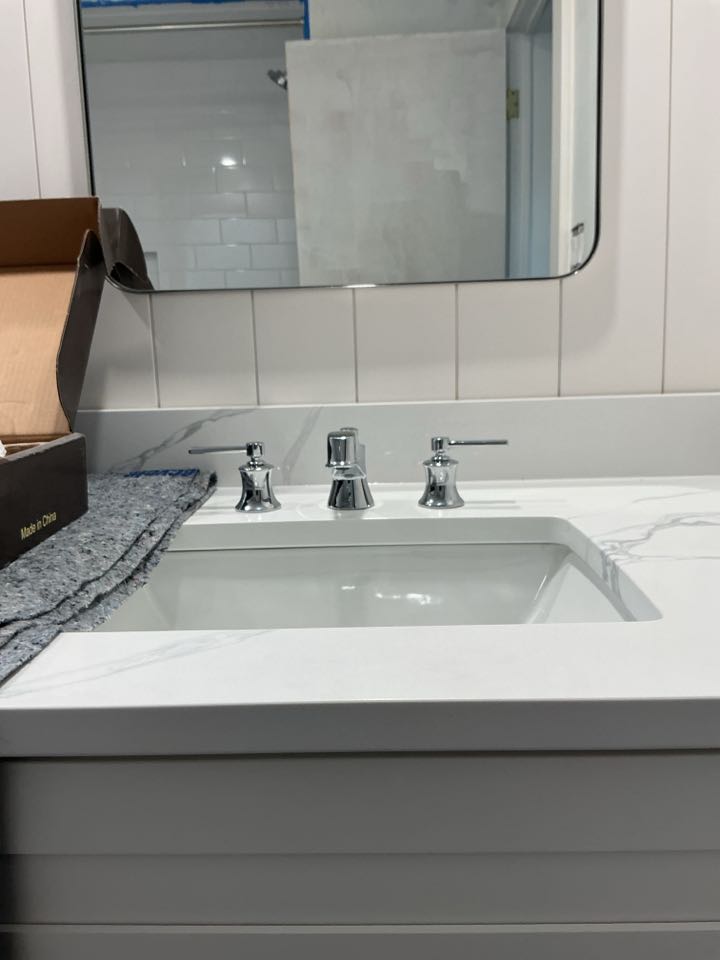 Installed customer supplied widespread bathroom faucet spread of faucet in Grosse pointe woods