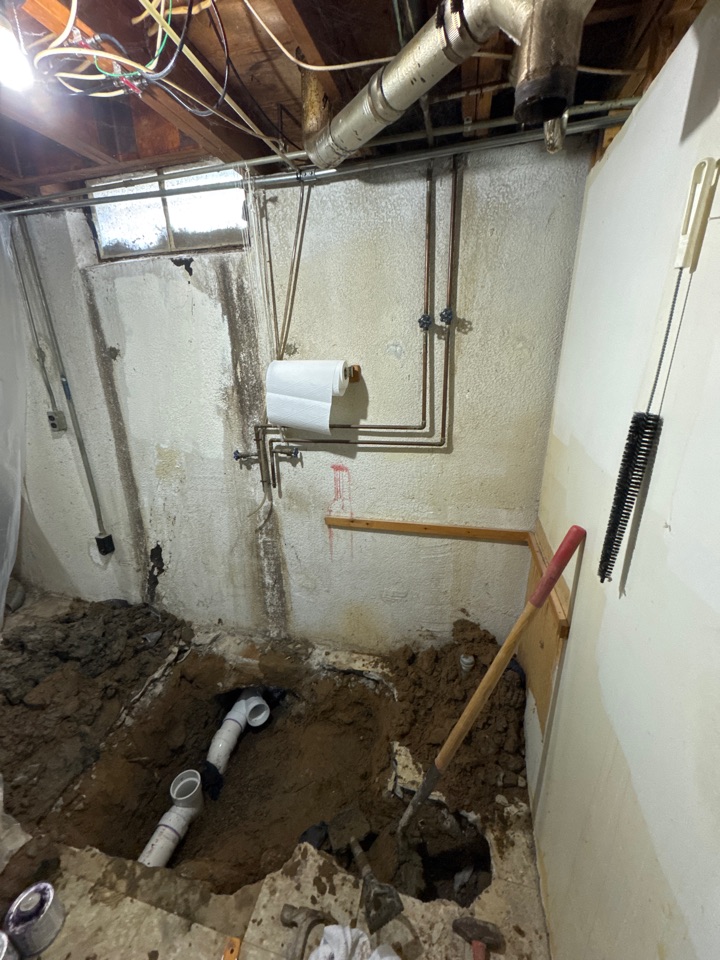 Broke open floor to install new cleanout for storm and sewer drain lines in South Gate 