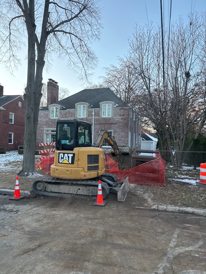 Cut out cement sidewalk and driveway to access sewer line 