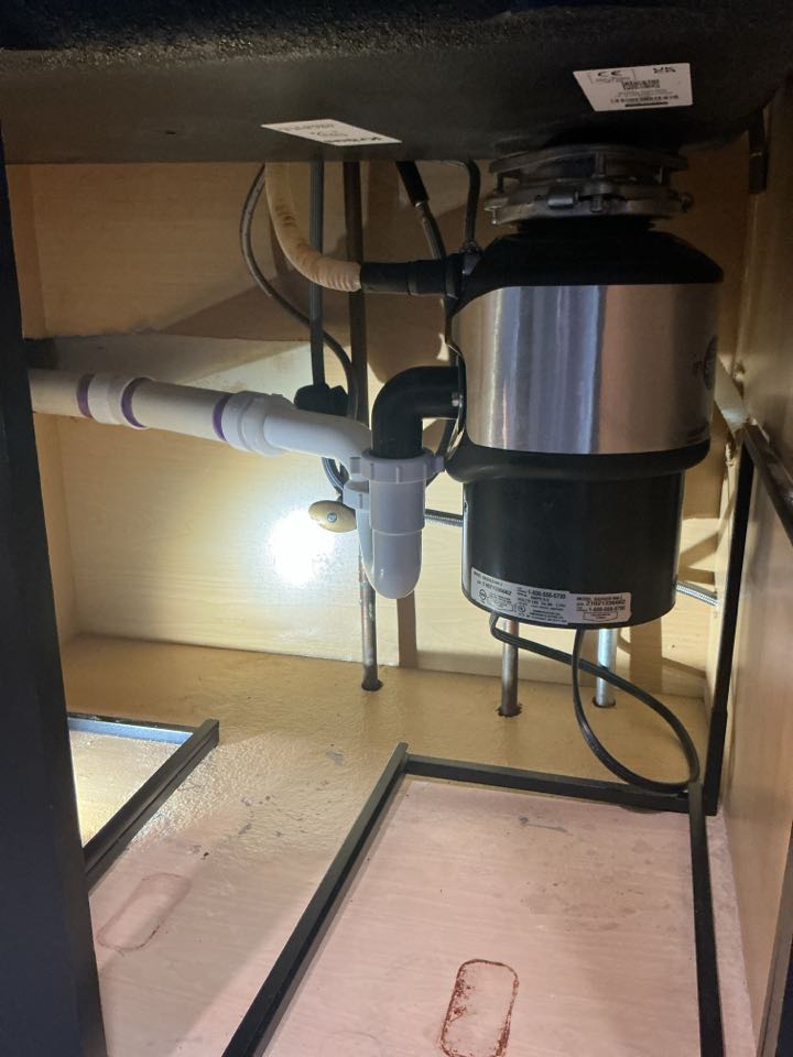 Installed customer supplied garbage disposal and hooked up kitchen drain in Northville